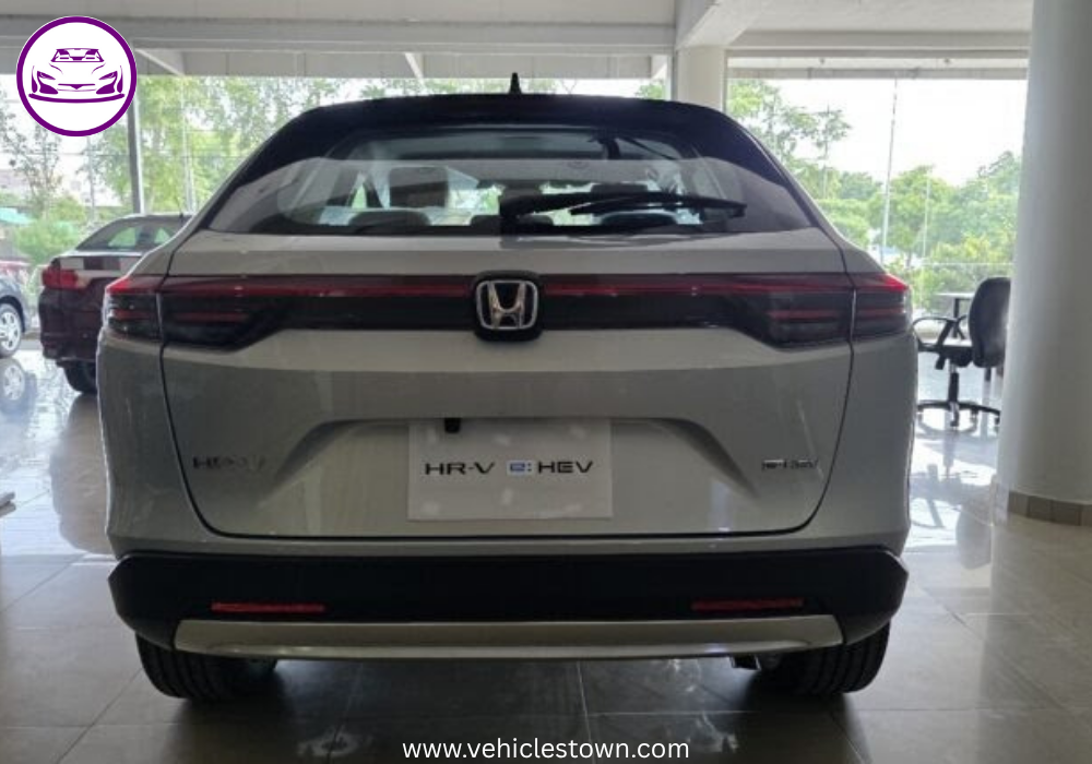 Front and side view of the 2025 Honda HR-V e:HEV hybrid SUV in Pakistan showcasing its LED headlights, bold grille, and sleek body design.