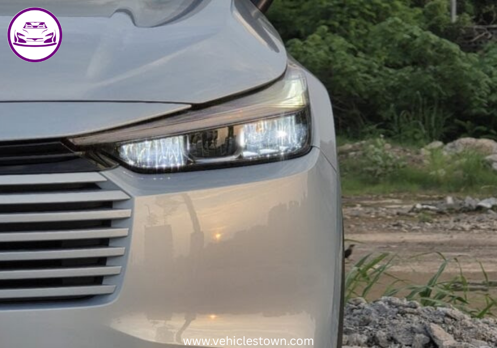 Front and side view of the 2025 Honda HR-V e:HEV hybrid SUV in Pakistan showcasing its LED headlights, bold grille, and sleek body design.