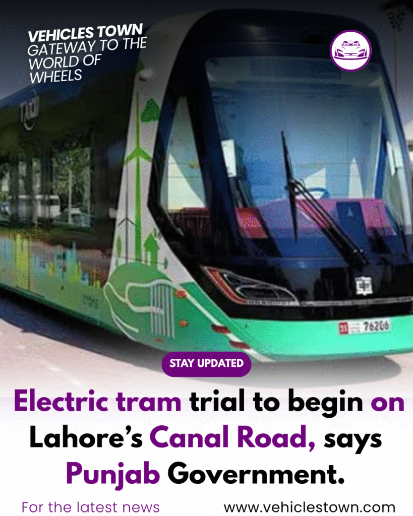 A modern electric tram moving on Lahore's Canal Road during a test run