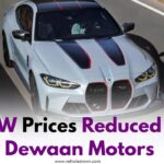 BMW vehicles lined up at a dealership with new reduced price tags after Dewan Motors' official announcement.