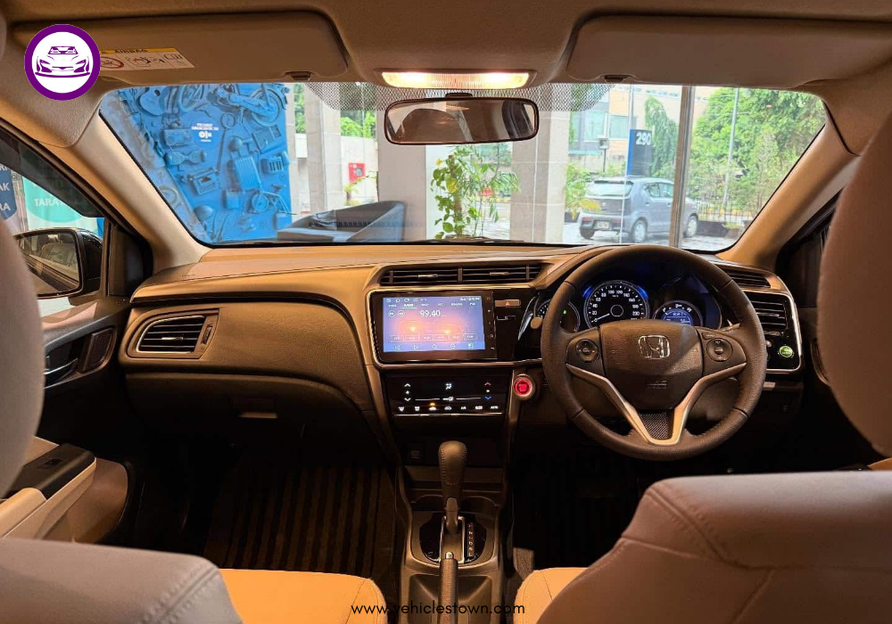 2025 Honda City Aspire S sedan in Canyon River Blue showing sleek LED headlamps and sporty alloy wheels.