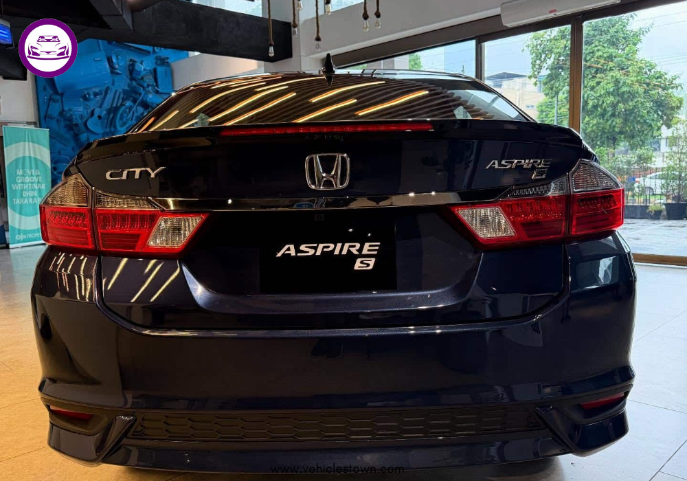 2025 Honda City Aspire S sedan in Canyon River Blue showing sleek LED headlamps and sporty alloy wheels.